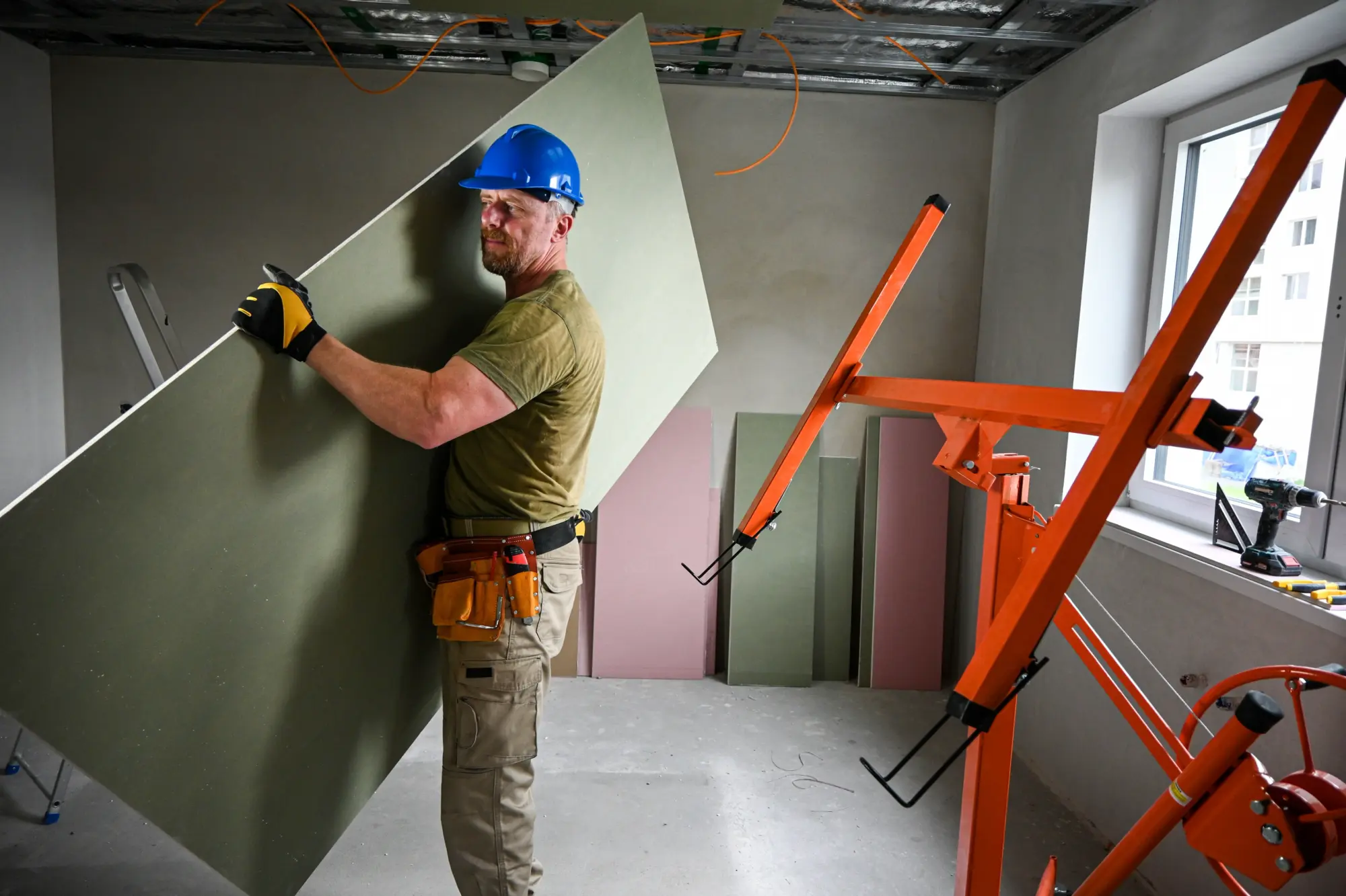 Construction worker lifting materials after shoulder subluxation