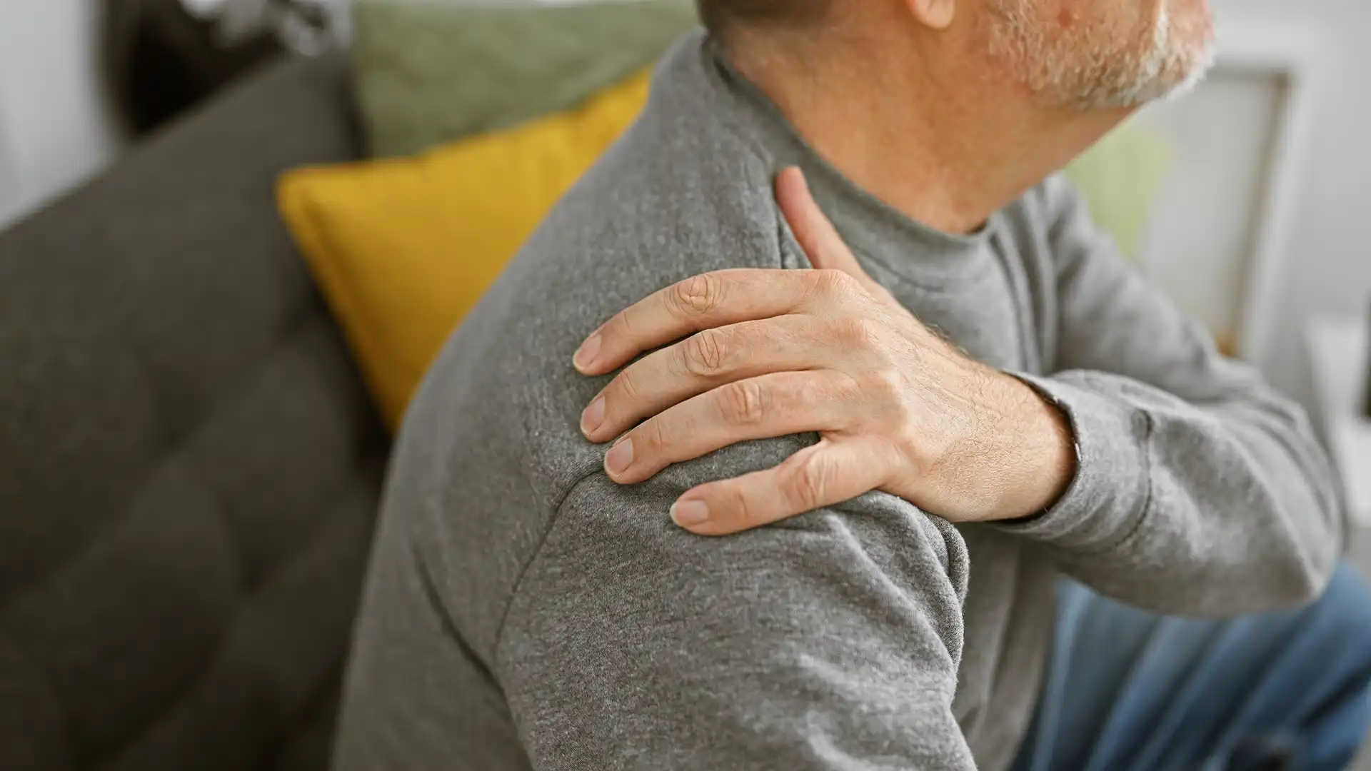 man holding his frozen shoulder